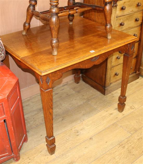 An Edwardian golden oak table and a smokers bow, W.92cm
